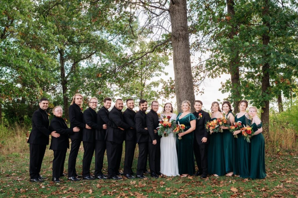 wedding party wearing dark green and black