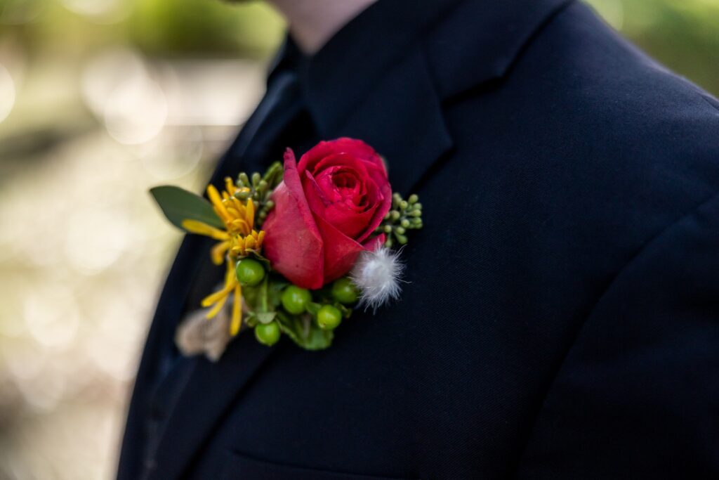 groom's bout with red rose