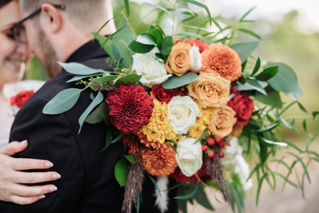 red orange yellow and white bridal bouquet