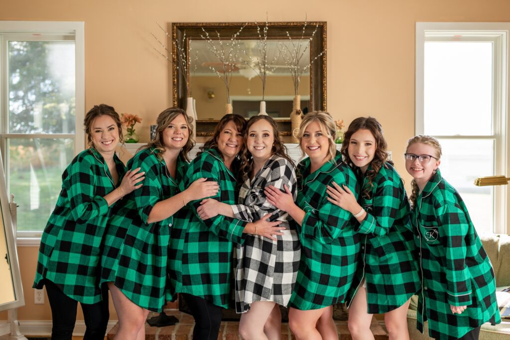 bridesmaids in green and black plaid matching pajamas