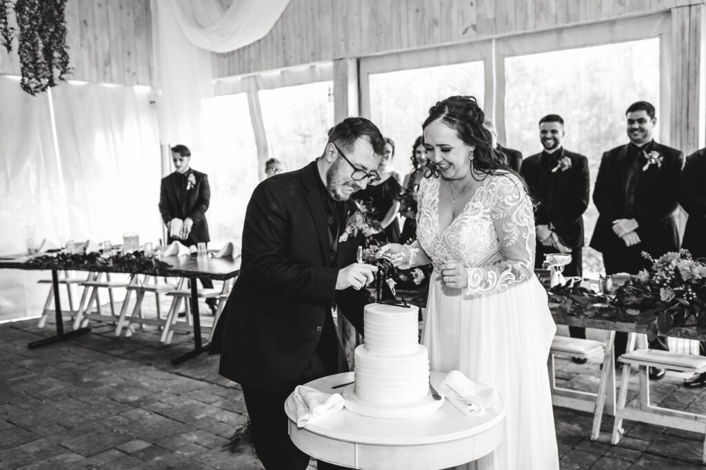 newlyweds cutting their cake at reception
