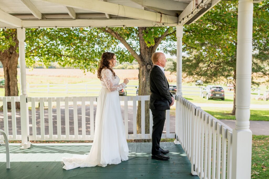 first look with dad on the porch at the bride house at old coon creek inn