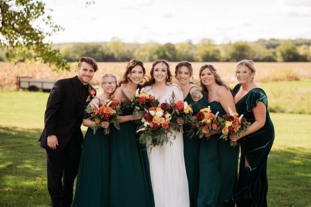 october wedding bridal party with green velvet bridesmaids dresses