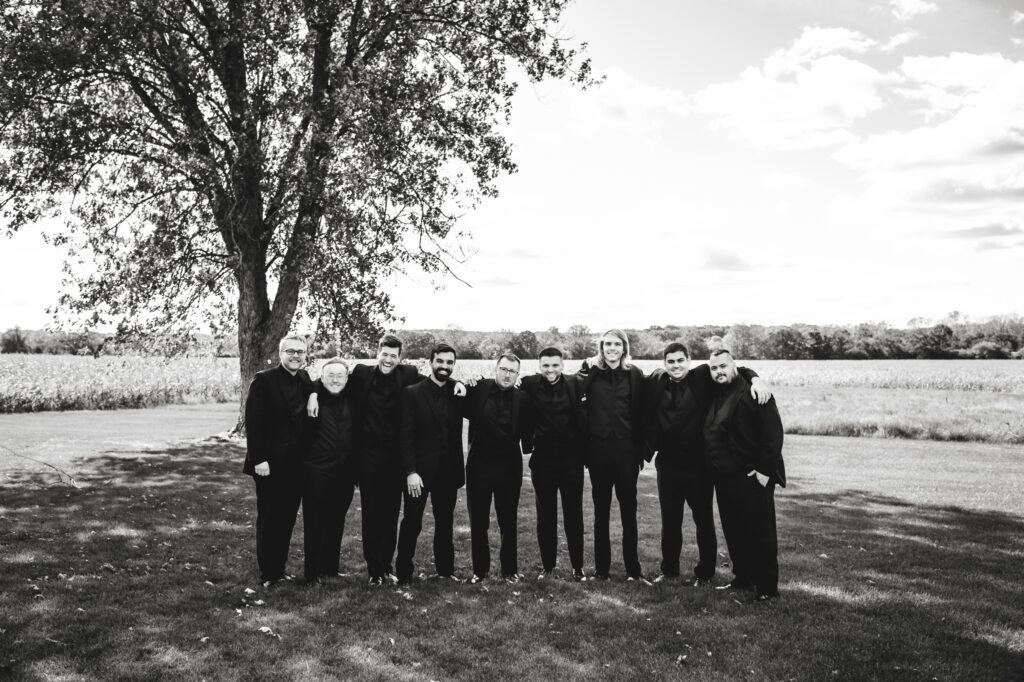grooms party wearing all black tuxes