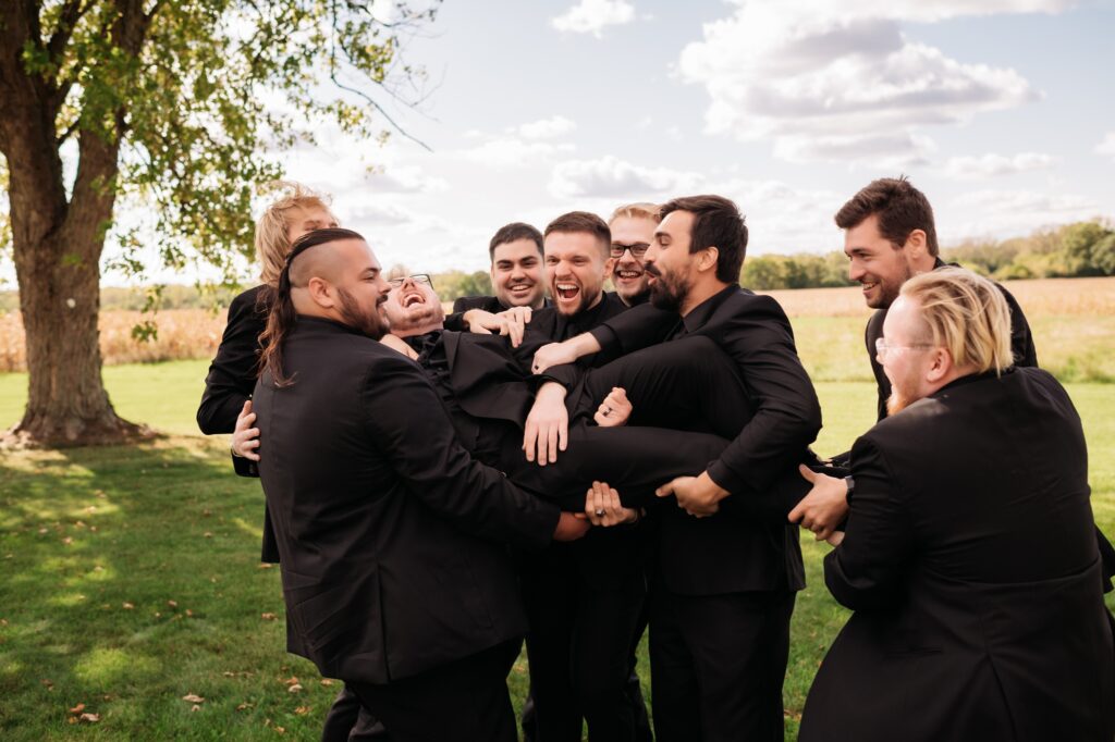 grooms party wearing all black tuxes