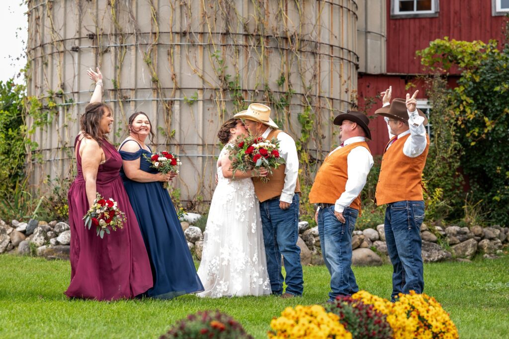 fall colored country wedding with cowboy hats and vests