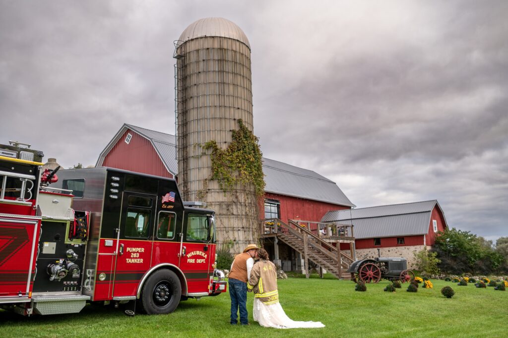 firefighter wedding with a fire truck