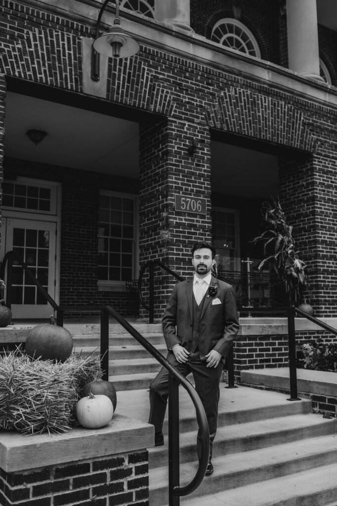 groom portraits in front of the stella hotel for wedding