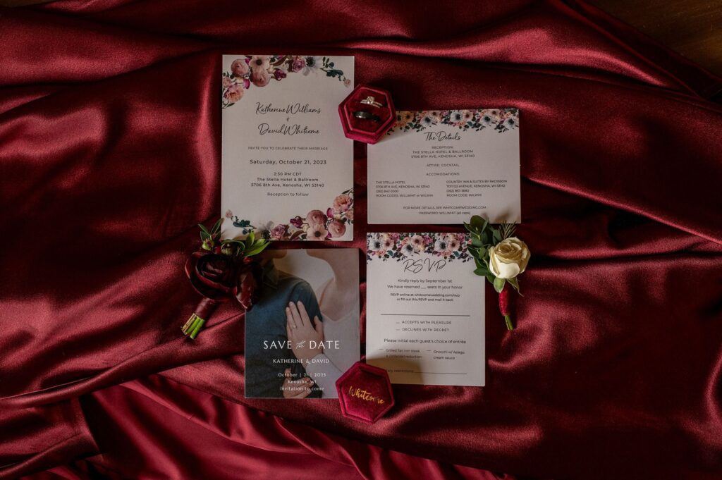 maroon and white wedding invitation suite with satin background