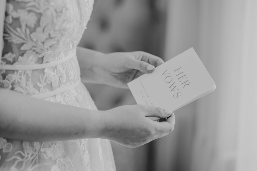 bride holding vow book