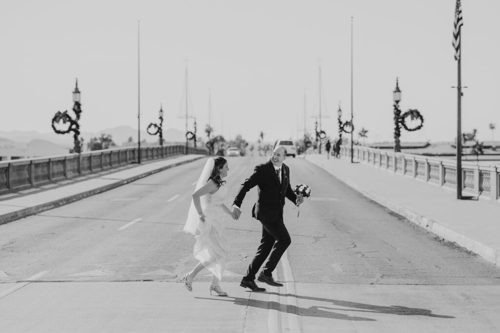 wedding photos running across the london bridge