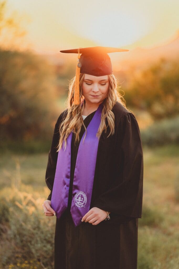 cap and gown photos at sunset