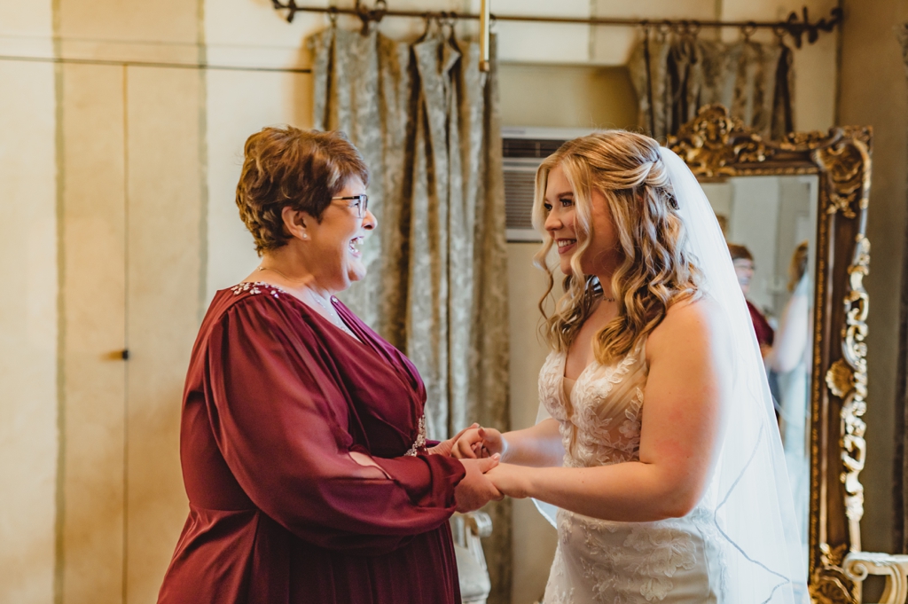 bride with mom before ceremony
