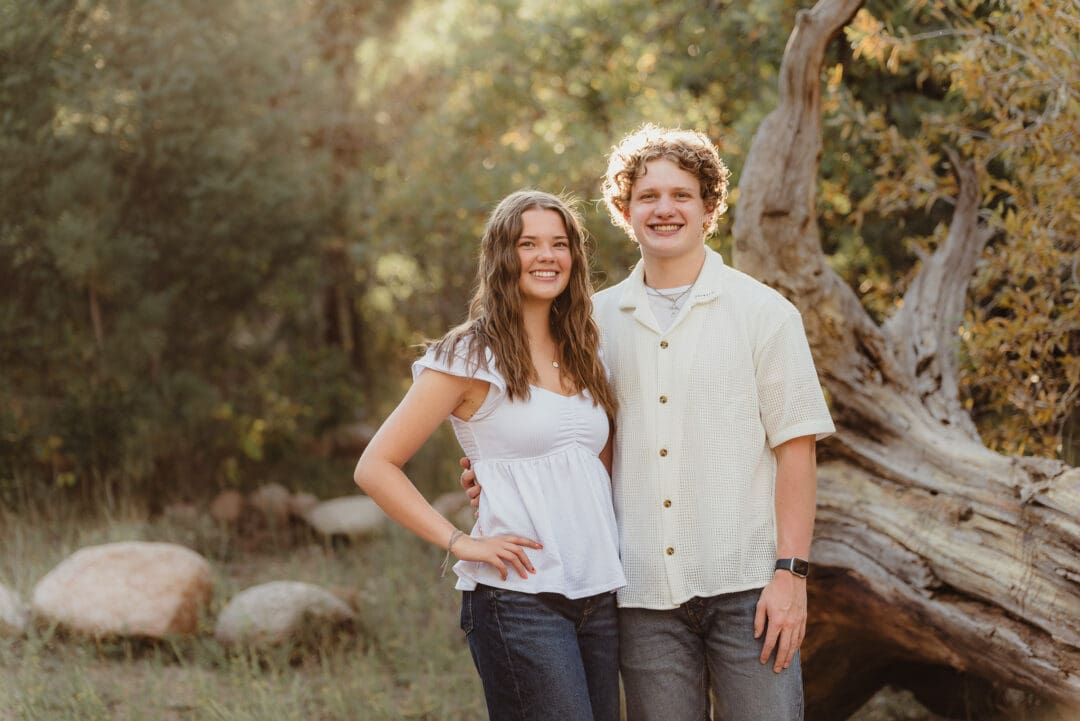 senior couples hoco proposal with a sign