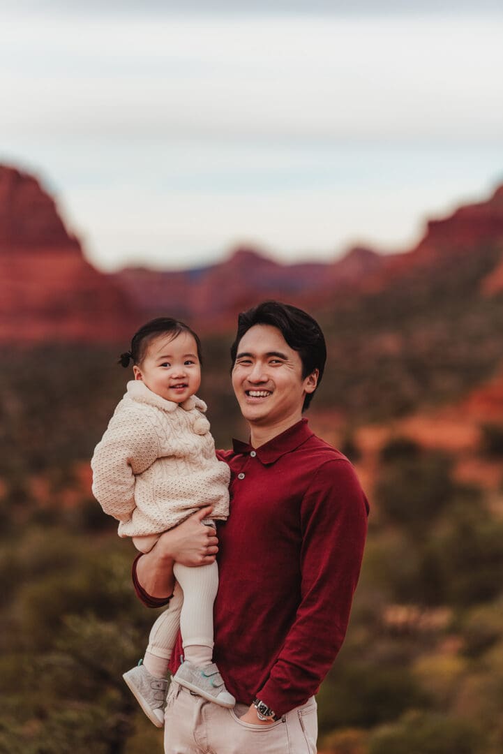 daddy and toddler girl poses for family photos