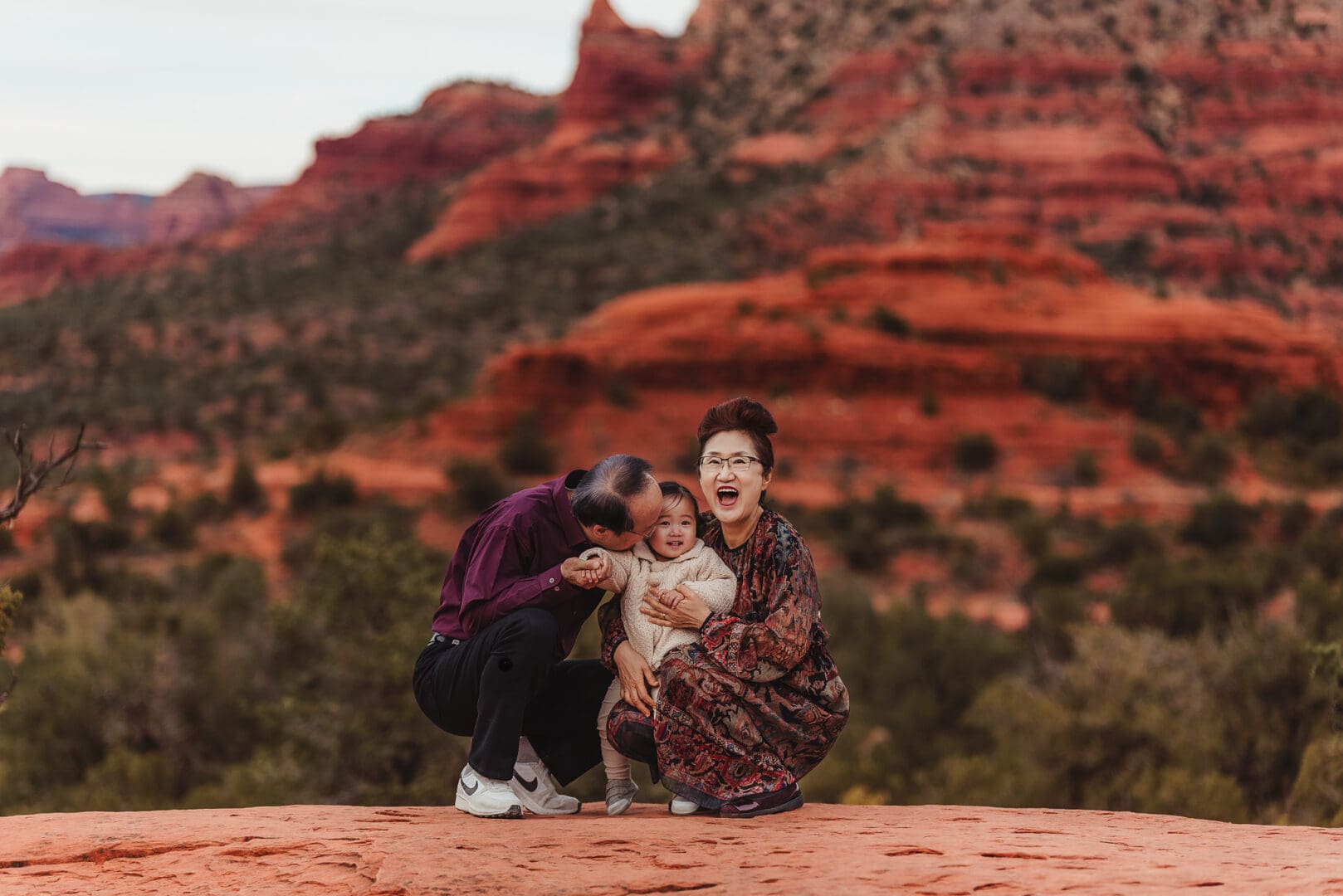 grandparents with their granddaughter