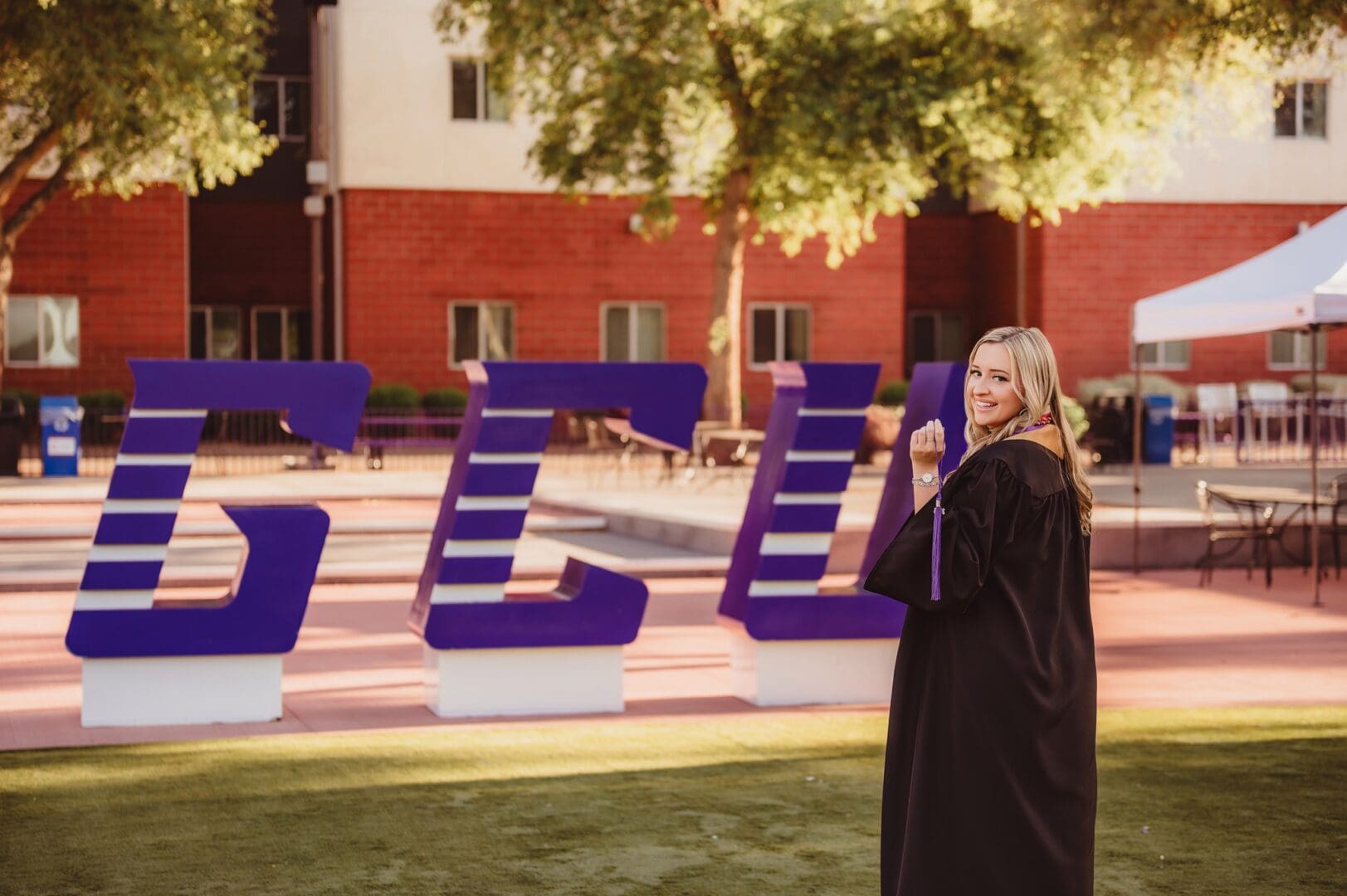 Grand Canyon University photos in front of the GCU Letters