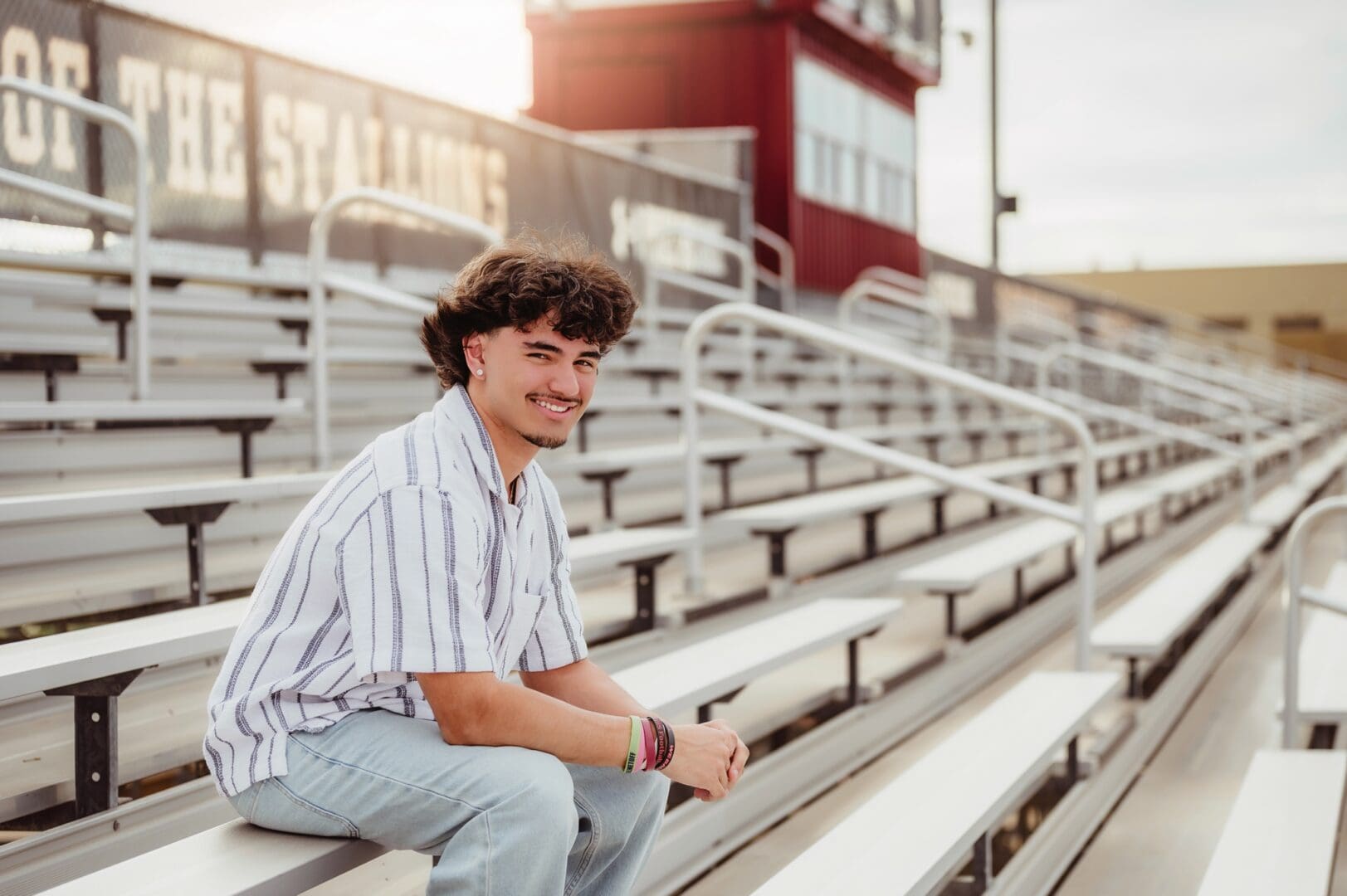 senior boy photos in the football stadium bleachers
