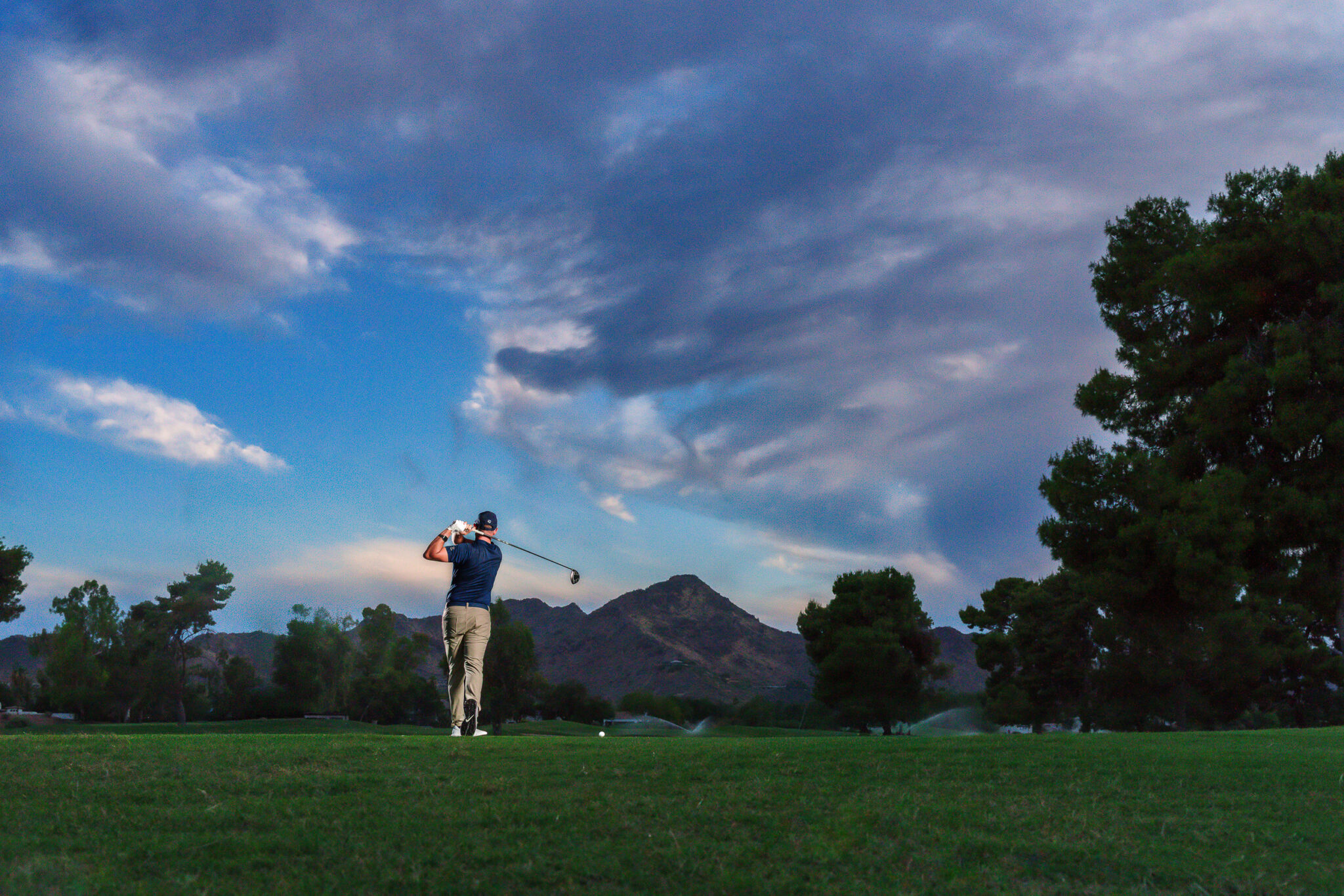 pga golf pro cody m ceccato swinging on the green at camelback golf course