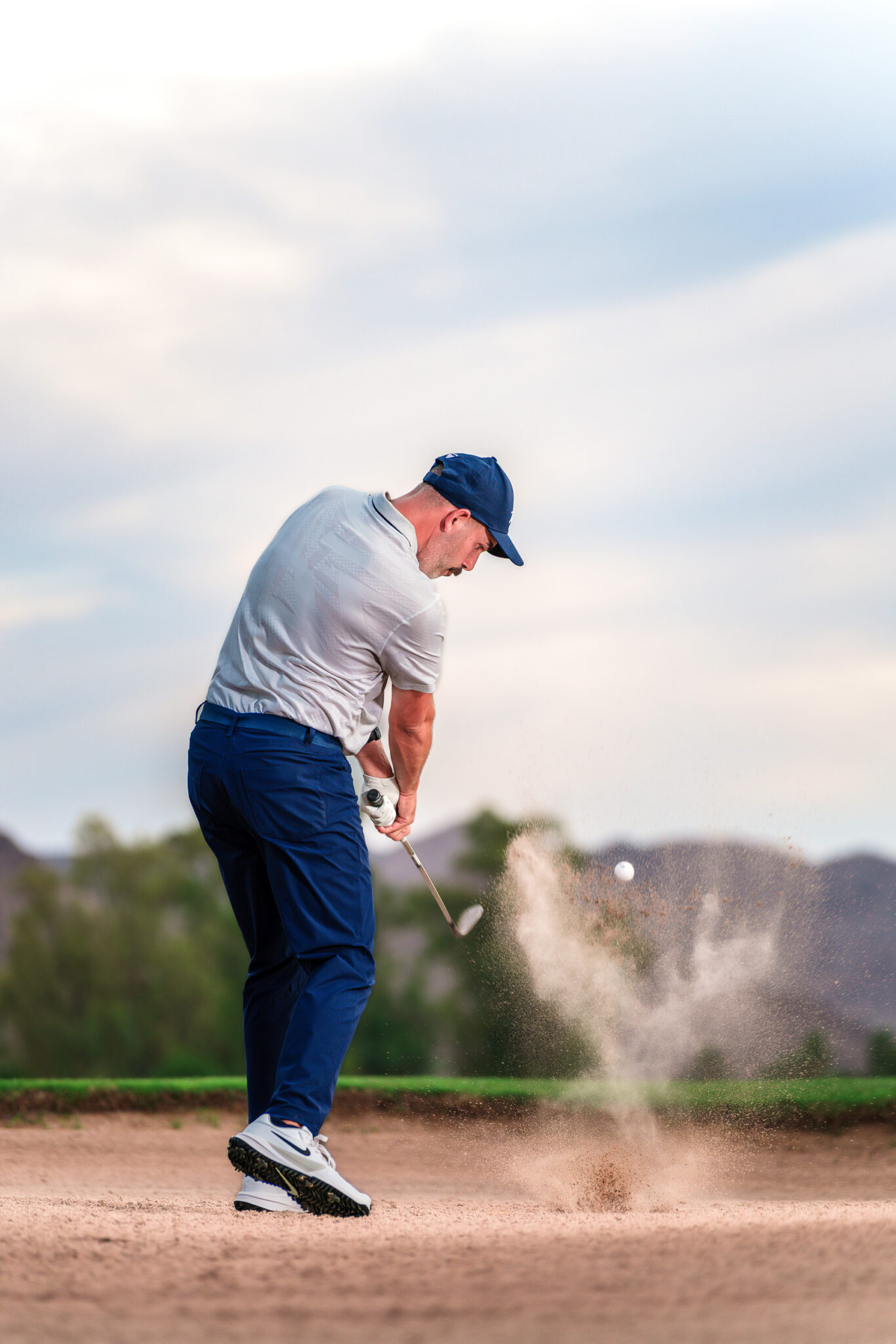 sports portraits for golfer in the sand
