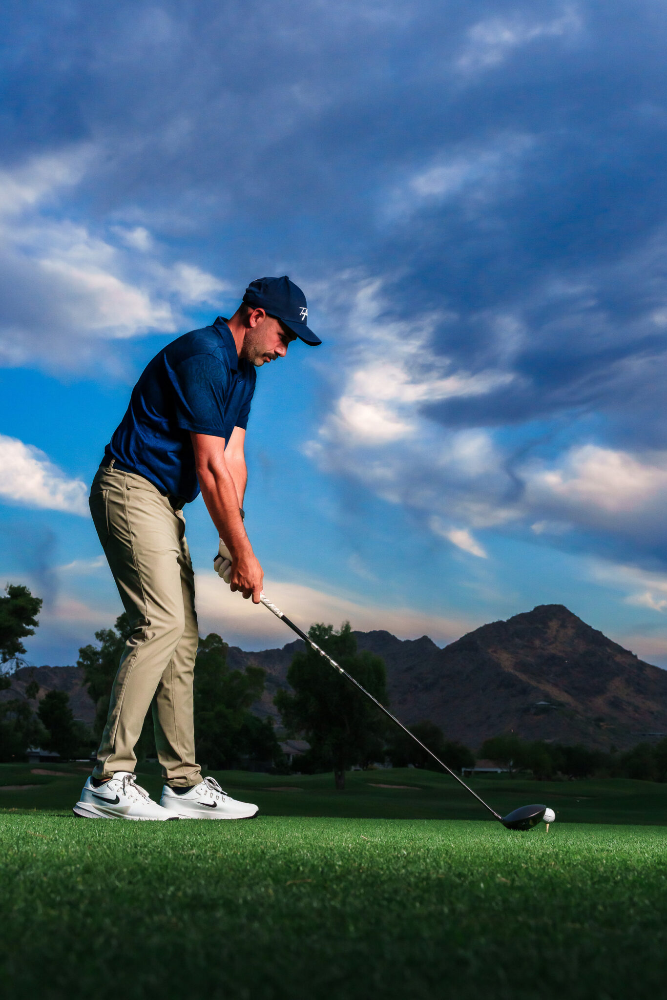 golf pro getting ready to swing for sports portrait