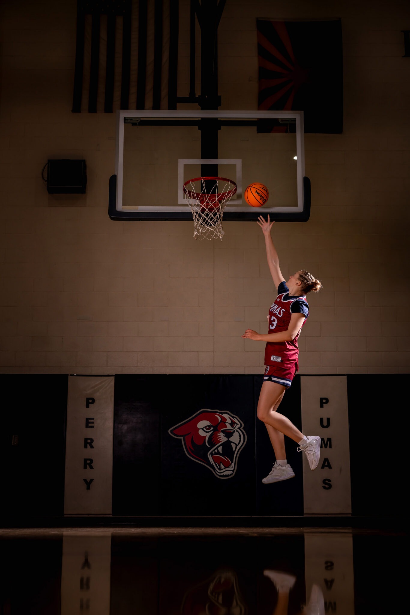 Action-inspired basketball portrait of a high school senior athlete in Arizona.