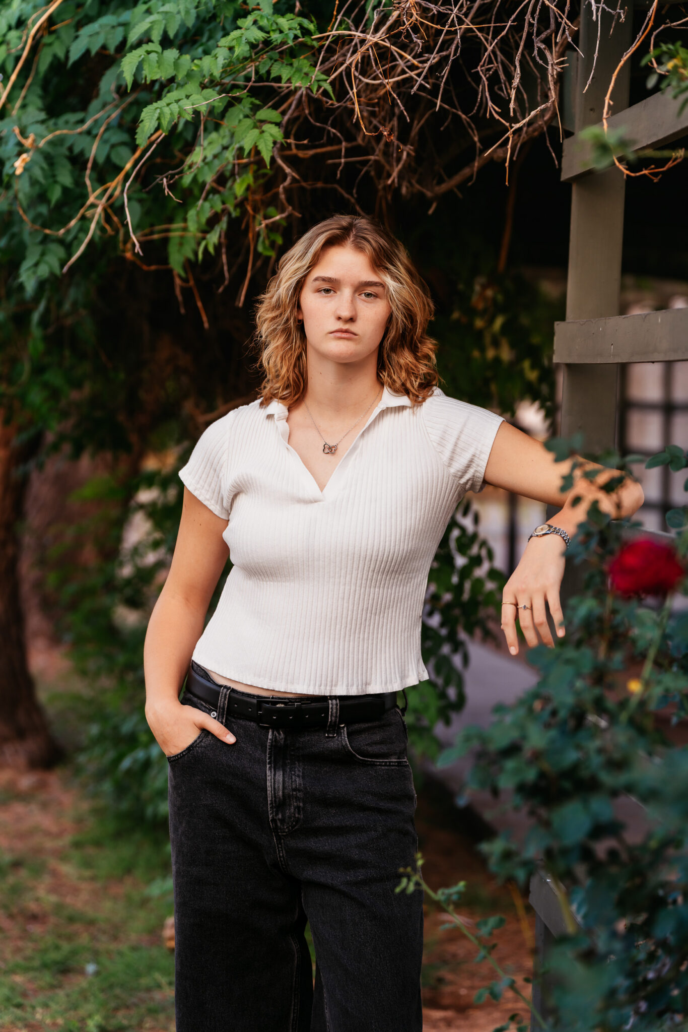 Phoenix senior photos with green garden and flowers