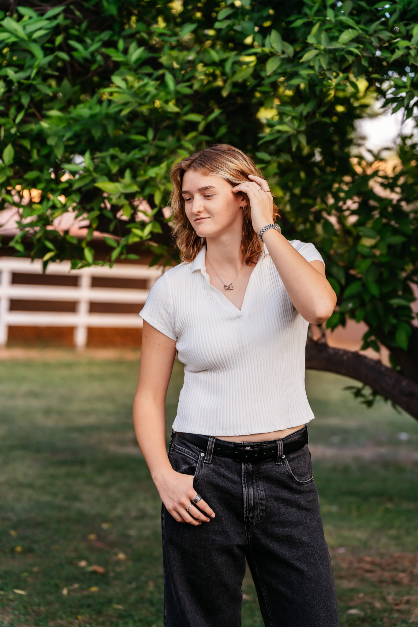 Manistee Ranch senior photo featuring lush landscaping